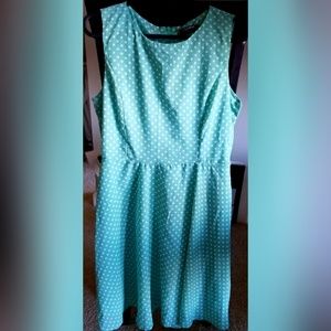 Green and white polk-a-dot mini dress